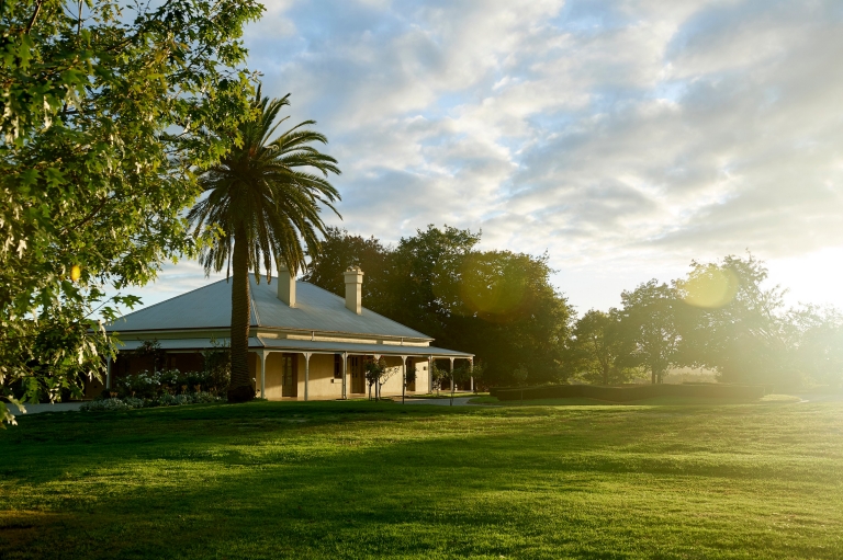 A side on view of The Chandon Homestead and the expansive lawn, Yarra Valley, Victoria © Chandon Homestead / Earl Carter Photography