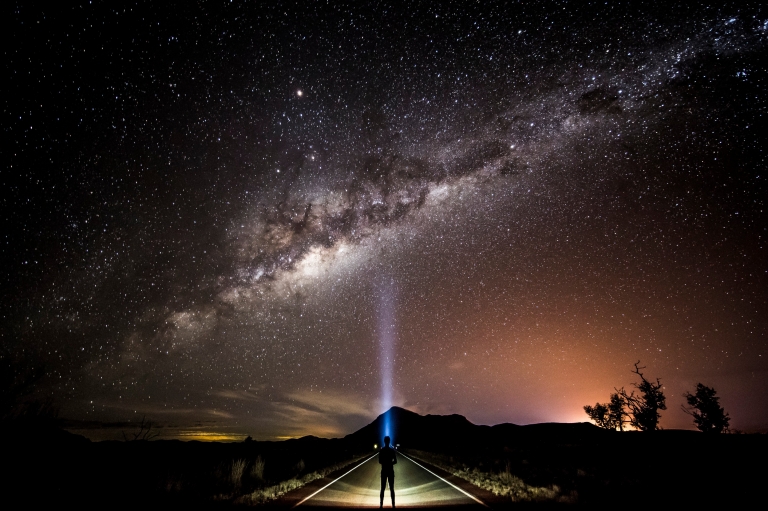 Stargazer with a head torch looking up at the milky way © Tourism and Events Queensland/Sean Scott Stargazer with a head torch looking up at the milky way © Tourism and Events Queensland/Sean Scott